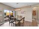 Dining room featuring modern light fixture and sliding door to outdoor patio at 11865 Barrentine Loop, Parker, CO 80138