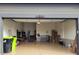 Spacious garage providing secure parking and storage, with epoxy flooring at 11865 Barrentine Loop, Parker, CO 80138
