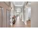 Inviting entryway featuring wood floors, neutral walls, and an arched doorway leading to other parts of the home at 11865 Barrentine Loop, Parker, CO 80138
