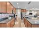 Well-equipped kitchen with stainless steel appliances and a large island with sink at 11865 Barrentine Loop, Parker, CO 80138