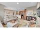 Open concept living room with view of kitchen and dining area, perfect for entertaining at 11865 Barrentine Loop, Parker, CO 80138