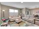 Comfortable living room with neutral tones, plush seating, and large windows at 11865 Barrentine Loop, Parker, CO 80138