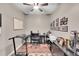 Office area with a ceiling fan, a rug, a desk, and a treadmill at 11865 Barrentine Loop, Parker, CO 80138