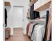 Organized walk-in closet with shelving and hanging rods for ample storage at 11865 Barrentine Loop, Parker, CO 80138