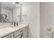 Stylish bathroom with geometric wallpaper and modern vanity at 1700 Bassett St # 101, Denver, CO 80202