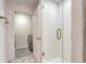 Modern bathroom with sleek glass shower, neutral color palette, and in-unit laundry access at 1700 Bassett St # 101, Denver, CO 80202