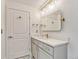 Bathroom with gold fixtures and white marble floor at 1700 Bassett St # 101, Denver, CO 80202