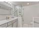 Modern bathroom with glass shower and grey vanity at 1700 Bassett St # 101, Denver, CO 80202