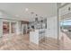 Well-appointed community kitchen with stainless steel appliances, bar seating, and bright lighting at 1700 Bassett St # 101, Denver, CO 80202
