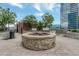 Rooftop grilling station with seating and a cozy fire pit, ideal for gatherings at 1700 Bassett St # 101, Denver, CO 80202