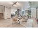 Bright living room boasts an open floor plan, with adjacent kitchen and dining areas, and modern decor at 1700 Bassett St # 101, Denver, CO 80202