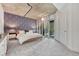 Modern primary bedroom with patterned accent wall and private balcony at 1700 Bassett St # 101, Denver, CO 80202