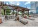 Beautiful rooftop lounge area with pergola, ample seating, and city views at 1700 Bassett St # 101, Denver, CO 80202