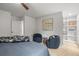 Bedroom features modern decor, stylish chairs, and an ensuite walk-in closet at 30938 Niakwa Rd, Evergreen, CO 80439