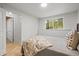 Bright bedroom with a view of the exterior through a window; also offers an entrance to the closet at 30938 Niakwa Rd, Evergreen, CO 80439