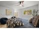 Bedroom features modern decor, a stylish bed, and large window with natural light at 30938 Niakwa Rd, Evergreen, CO 80439