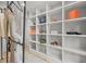 Custom closet with built in shelving and stylish decor at 30938 Niakwa Rd, Evergreen, CO 80439