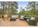 Outdoor deck features ample seating, creating an ideal space for relaxation and entertainment at 30938 Niakwa Rd, Evergreen, CO 80439