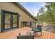 Relaxing deck with views of the mountains and stylish chairs at 30938 Niakwa Rd, Evergreen, CO 80439
