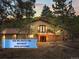 Charming multi-level home with a cozy deck nestled amongst the trees with beautiful sunset views at 30938 Niakwa Rd, Evergreen, CO 80439