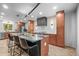 Open concept kitchen with an island, bar seating, and stainless steel appliances at 30938 Niakwa Rd, Evergreen, CO 80439