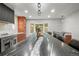 Contemporary kitchen featuring a spacious island with bar stools and modern appliances at 30938 Niakwa Rd, Evergreen, CO 80439