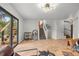 Open floor plan featuring a staircase, wood floors, and modern lighting at 30938 Niakwa Rd, Evergreen, CO 80439