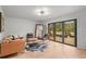 Bright living room with a cozy seating area and access to the outdoors at 30938 Niakwa Rd, Evergreen, CO 80439