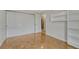Bright bedroom featuring hardwood floors, large closet, and built-in shelving at 4800 E Hale Pkwy # 802N, Denver, CO 80220