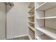 Spacious walk-in closet with built-in shelving and cubbies for optimal organization and storage at 4800 E Hale Pkwy # 802N, Denver, CO 80220