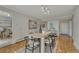 Well-lit dining room with a modern table setting and hardwood floors at 4800 E Hale Pkwy # 802N, Denver, CO 80220