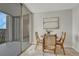 Cozy dining nook with balcony access, natural light, and comfortable seating at 4800 E Hale Pkwy # 802N, Denver, CO 80220