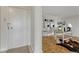 Inviting entryway with a secure front door and warm wood flooring leading to a bright, modern living space at 4800 E Hale Pkwy # 802N, Denver, CO 80220