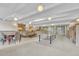 Bright game room with ping pong table, seating, and bookshelves at 4800 E Hale Pkwy # 802N, Denver, CO 80220