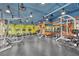 Well-equipped gym featuring treadmills, weight machines, and free weights with colorful accent walls at 4800 E Hale Pkwy # 802N, Denver, CO 80220