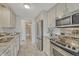 Well-lit kitchen featuring stainless steel appliances and contrasting countertops at 4800 E Hale Pkwy # 802N, Denver, CO 80220