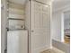 Laundry area featuring a washing machine, shelving, and storage space at 4800 E Hale Pkwy # 802N, Denver, CO 80220