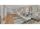 Open living room featuring contemporary furniture and hardwood floors at 4800 E Hale Pkwy # 802N, Denver, CO 80220