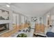 Open-concept living area with fireplace, hardwood floors, modern decor, and ample natural light at 4800 E Hale Pkwy # 802N, Denver, CO 80220