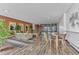 Inviting lounge area boasts exposed brick, wood floors, comfortable seating, and natural light at 4800 E Hale Pkwy # 802N, Denver, CO 80220