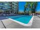 Outdoor pool with lounge chairs and surrounding community building at 4800 E Hale Pkwy # 802N, Denver, CO 80220