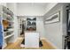 Organized walk-in closet with custom shelving and storage solutions at 2635 Pierce St, Wheat Ridge, CO 80214