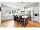 Contemporary kitchen with an island, stainless steel appliances, and bright lighting at 2635 Pierce St, Wheat Ridge, CO 80214