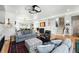 Bright living and dining space features modern lighting and an open floor plan at 2635 Pierce St, Wheat Ridge, CO 80214