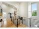 Upstairs hallway with high ceilings, modern railing, and natural light at 2635 Pierce St, Wheat Ridge, CO 80214