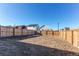 Fenced backyard with open space at 2937 Pershing St, Strasburg, CO 80136