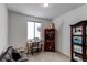 Cozy bedroom with a workspace, window seat and a wooden cabinet at 2937 Pershing St, Strasburg, CO 80136