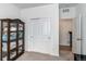 Bedroom with double door closet and access to a hallway at 2937 Pershing St, Strasburg, CO 80136