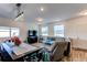 Open concept dining area with hardwood floors and a large window at 2937 Pershing St, Strasburg, CO 80136