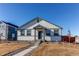 House exterior with walkway and landscaping at 2937 Pershing St, Strasburg, CO 80136